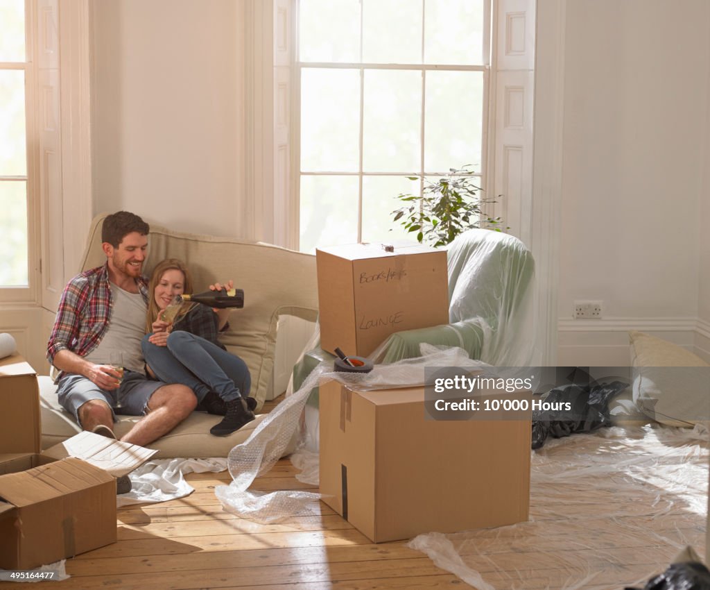 A couple celebrating moving into their new home