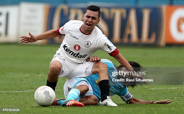 Jorge Cazulo of Sporting Cristal struggles for the ball with Enrique Salcedo of Leon de Huanuco during a match between Sporting Cristal and Leon de...