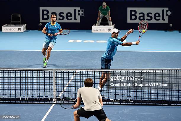 Jean-Julien Rojer of Netherlands and Horia Tecau of Romania in action in their semi-finals loss to Alexander Peya of Austria and Bruno Soares of...