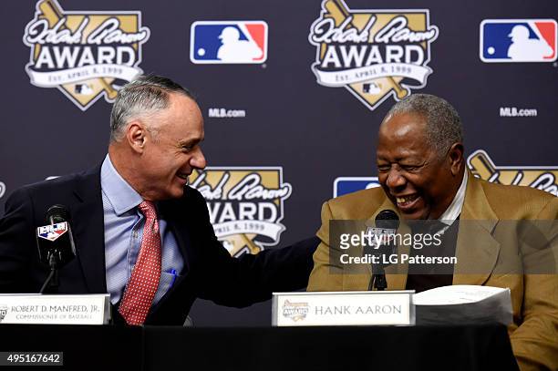 Major League Baseball Commissioner Robert D. Manfred Jr. And Hall of Famer Hank Aaron share a laugh during the 2015 Hank Aaron Award press conference...