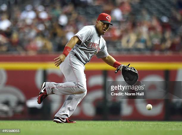 Brayan Pena of the Cincinnati Reds attempts to make a play on a ground ball in the first inning against the Arizona Diamondbacks at Chase Field on...