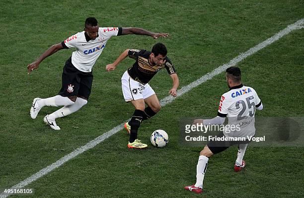 Cleber and Bruno Henrique of Corinthians fights for the ball with Daniel of Botafogo during the match between Corinthians and Botafogo for the...