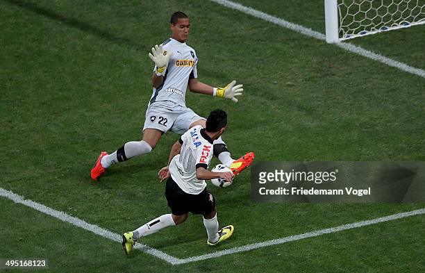 Petros of Corinthians fights for the ball with Renan of Botafogo during the match between Corinthians and Botafogo for the Brazilian Series A 2014 at...
