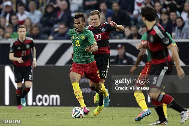 Eric M. Choupo-Moting of Cameroon, Mario Gotze of Germany during the Frendly match between Germany and Cameroon at Borussia-Park on June 01, 2014 in...