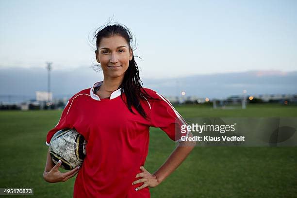 portrait of cool female soccer player holding ball - camisola de futebol imagens e fotografias de stock