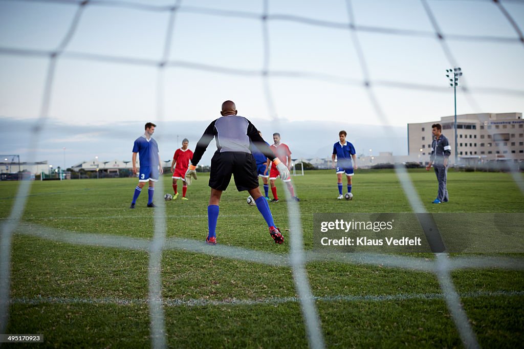 Back view of goalkeeper at soccer game