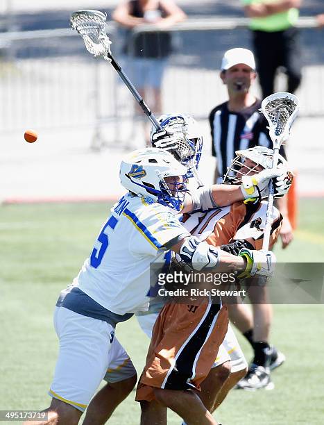 John Ortolani of the Rochester Rattlers is checked off the ball by Josh Amidon of the Florida Launch at Sahlen's Stadium on June 1, 2014 in...