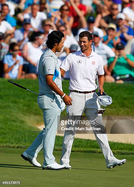 Hideki Matsuyama of Japan and Adam Scott of Australia congratulate one another after the 18th hole during the final round of the Memorial Tournament...