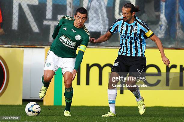 Hernan Barcos of Gremio battles for the ball against Lucio of Palmeiras during the match Gremio v Palmeiras as part of Brasileirao Series A 2014 at...