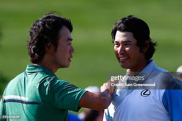 Hideki Matsuyama of Japan is congratulated by Kevin Na after winning the Memorial Tournament presented by Nationwide Insurance in a playoff at...