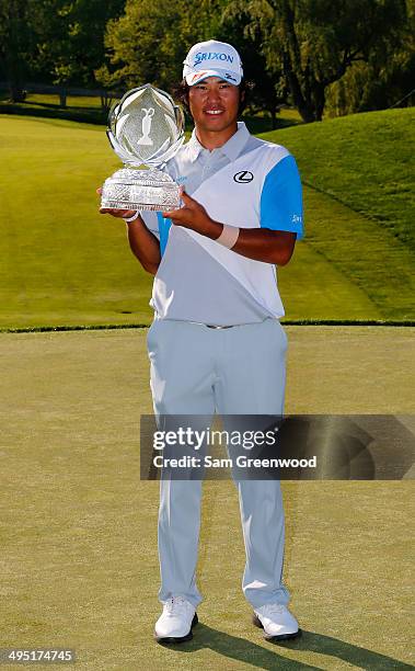 Hideki Matsuyama of Japan holds the trophy after winning the Memorial Tournament presented by Nationwide Insurance at Muirfield Village Golf Club on...