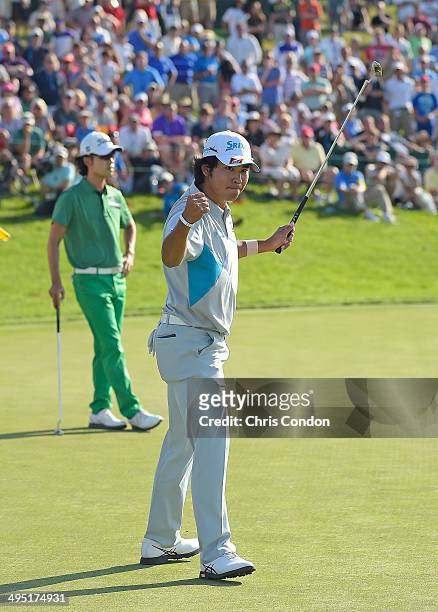 Hideki Matsuyama of Japan reacts on the 18th green after making birdie on the first playoff hole against Kevin Na to win the Memorial Tournament...