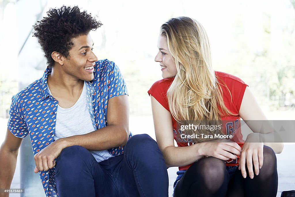 Young man and woman talking and having fun