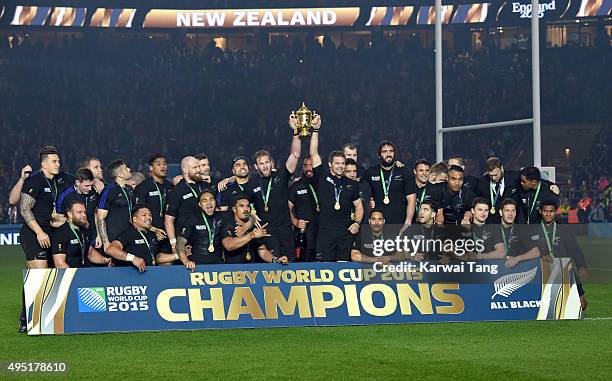 The New Zealand rugby team celebrate after defeating Australia in the Rugby World Cup Final at Twickenham Stadium on October 31, 2015 in London,...