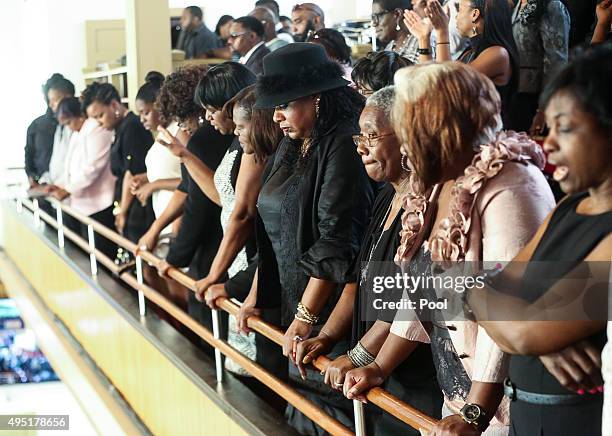 In this handout photo provided by the Palm Beach Post, people watch from the balcony seats during the funeral for Corey Jones at Payne Chapel AME at...