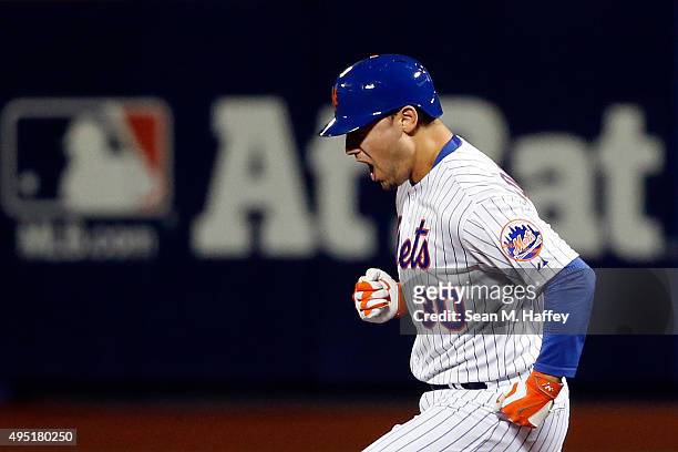 Michael Conforto of the New York Mets rounds the bases after hitting a solo home run in the fifth inning against Danny Duffy of the Kansas City...
