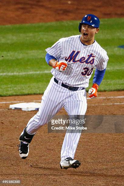 Michael Conforto of the New York Mets rounds the bases after hitting a solo home run in the fifth inning against Danny Duffy of the Kansas City...
