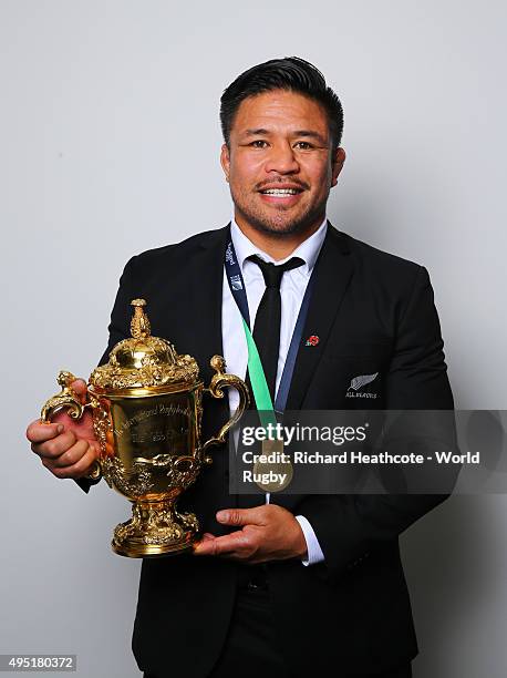 Kevin Mealamu of the New Zealand All Blacks poses with the Webb Ellis Cup after the 2015 Rugby World Cup Final match between New Zealand and...