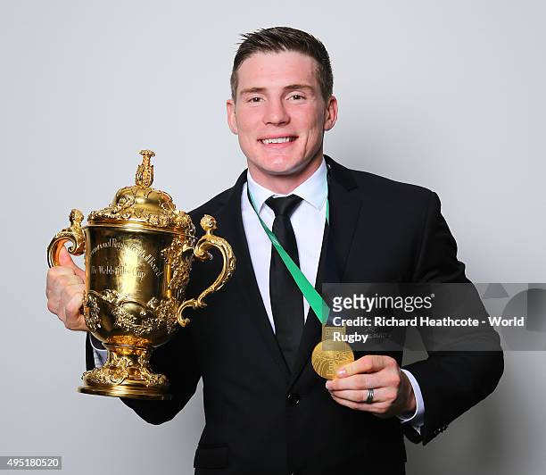 Colin Slade of the New Zealand All Blacks poses with the Webb Ellis Cup after the 2015 Rugby World Cup Final match between New Zealand and Australia...
