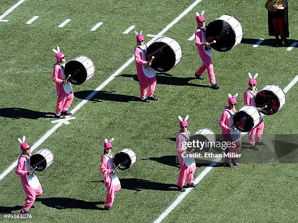 Members of the UNLV Rebels marching band perform in costumes before the team's game against the Boise State Broncos at Sam Boyd Stadium on October...