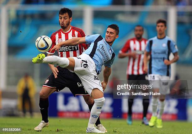 Esteban Espindola Lopez of Belgrano fights for the ball with Juan Sanchez Miño, of Estudiantes during a match between Belgrano and Estudiantes as...