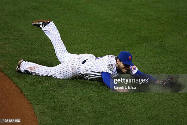 Daniel Murphy of the New York Mets fails to make a play on a ball hit by Mike Moustakas of the Kansas City Royals in the eight inning of Game Four of...