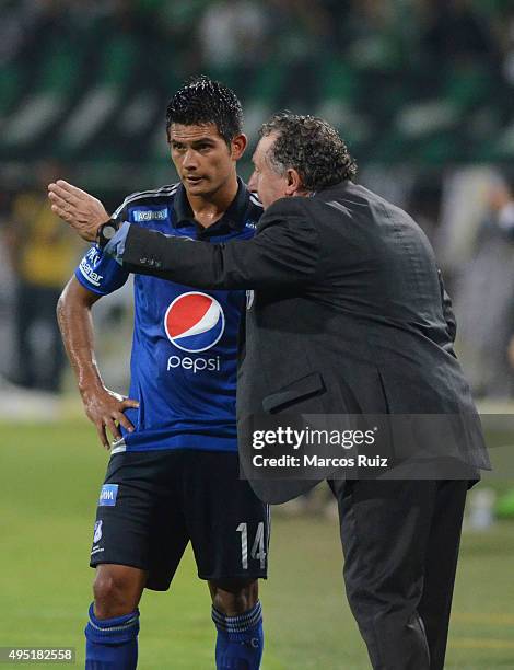 Ruben Israel coach of Millonarios gives instructions to David Silva during a match between Atletico Nacional and Millonarios as part of Liga Aguila...