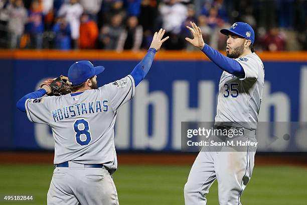 Mike Moustakas and Eric Hosmer of the Kansas City Royals reacts after defeating the New York Mets by a score of 5-3 to win Game Four of the 2015...