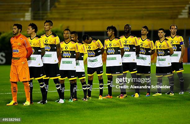 Players of Santos and Criciuma stand for National anthen before the match between Santos and Criciuma for the Brazilian Series A 2014 at Primeiro de...