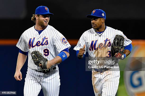 Kirk Nieuwenhuis and Curtis Granderson of the New York Mets jog back to the dugout during Game 4 of the 2015 World Series against the Kansas City...