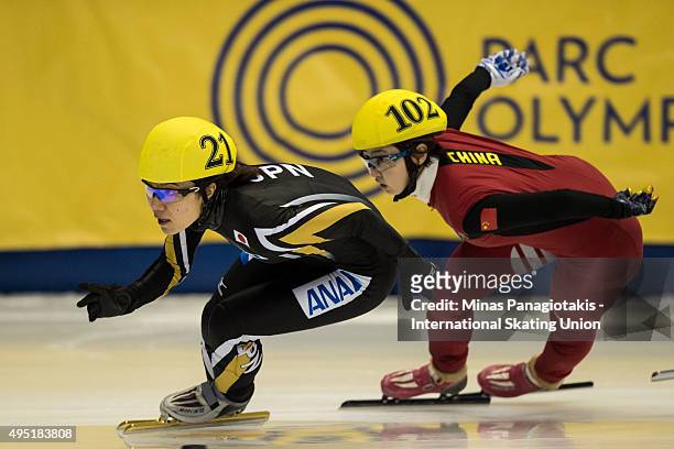 Yui Sakai of Japan stays in front of Liu Yang of China on Day 1 of the ISU World Cup Short Track Speed Skating competition at Maurice-Richard Arena...