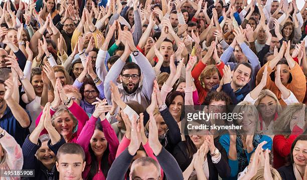 large group of happy people applauding. - applauding stock pictures, royalty-free photos & images