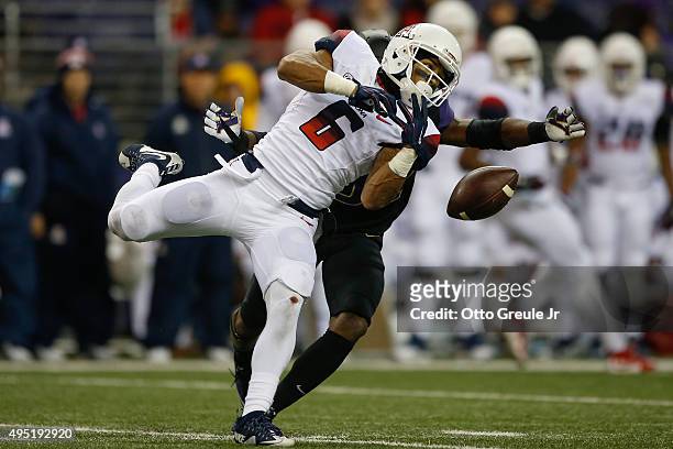 Wide receiver Nate Phillips of the Arizona Wildcats can't make this catch against defensive back Budda Baker of the Washington Huskies on October 31,...