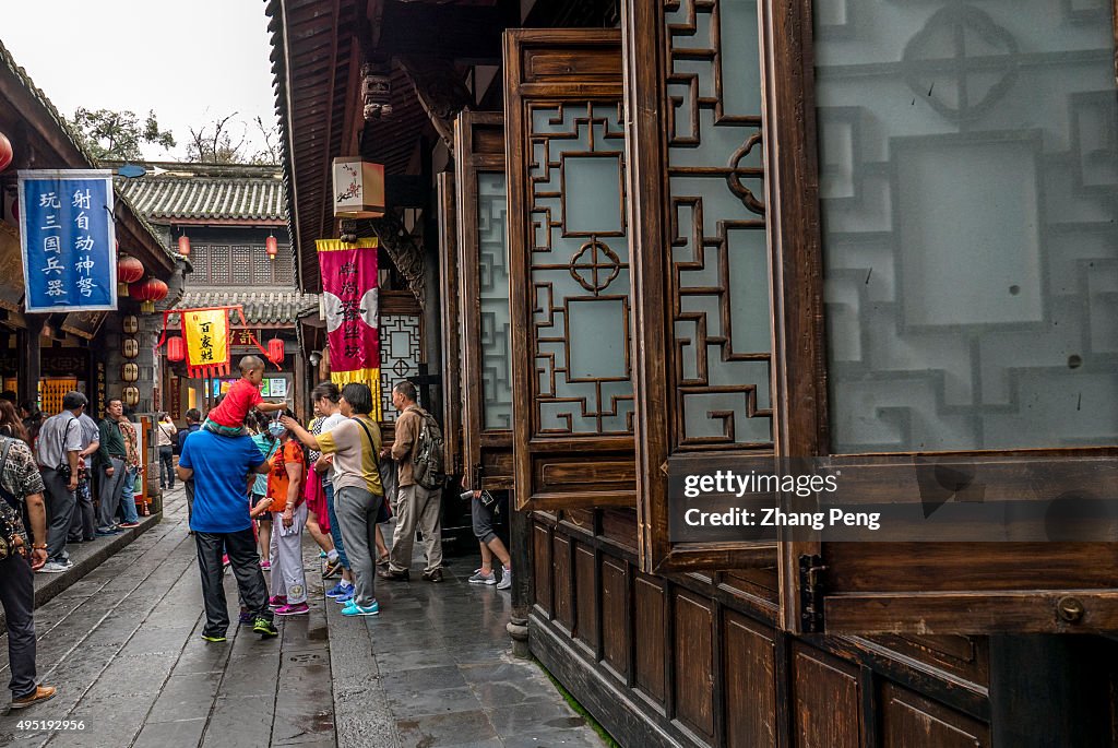 Tourists on the street.  Jinli Pedestrian Street, located to...