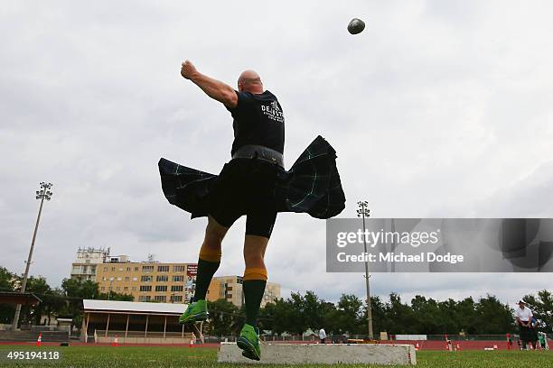 Scott Martin, an Australian Olympic Shot Putter, takes part in the Stone Put discipline in the Highland Games during Bendigo Fit Weekend on November...
