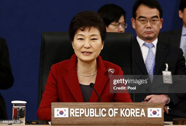 South Korean President Park Geun-Hye, talks with Japanese Prime Minister Shinzo Abe and Chinese Prime Minister Li Keqiang during their trilateral...