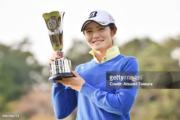 Ayaka Watanabe of Japan poses with the trophy after winning the Higuchi Hisako Ponta Ladies at the Musashigaoka Golf Course on November 1, 2015 in...