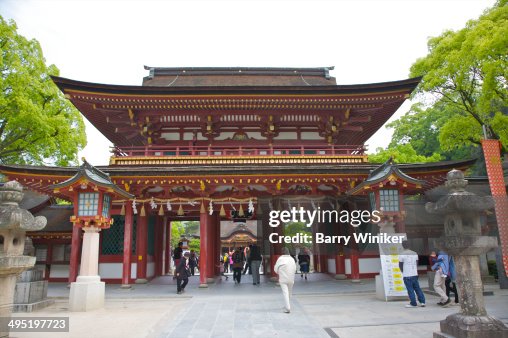 People walking through shrine entrance People walking through shrine entrance