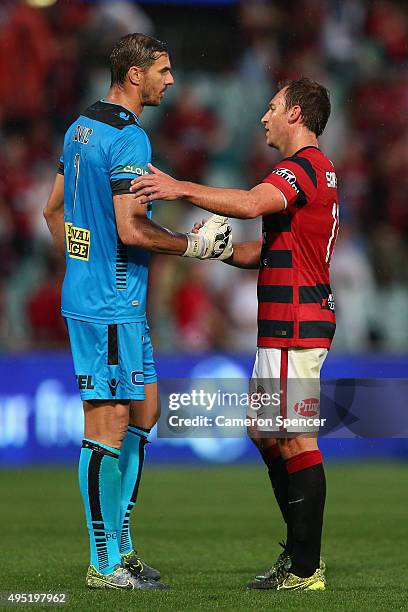 Ante Covic of the Glory congratulates Brendon Santalab of the Wanderers after winning the round four A-League match between the Western Sydney...