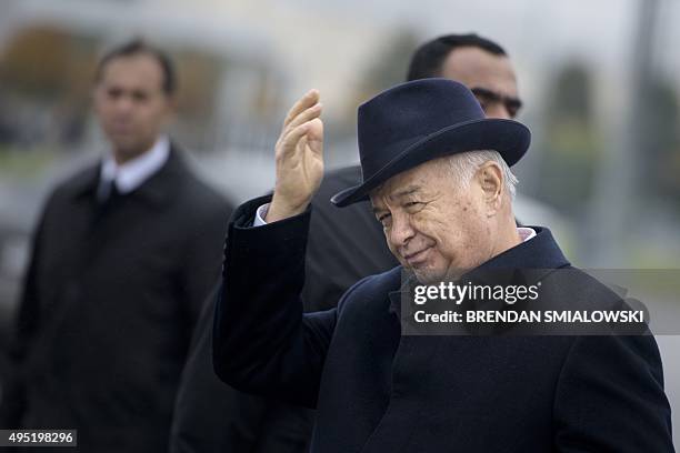 Uzbek President Islam Karimov gestures after greeting US Secretary of State John Kerry at Samarkand Airport on November 1, 2015 in Samarkand. Kerry...