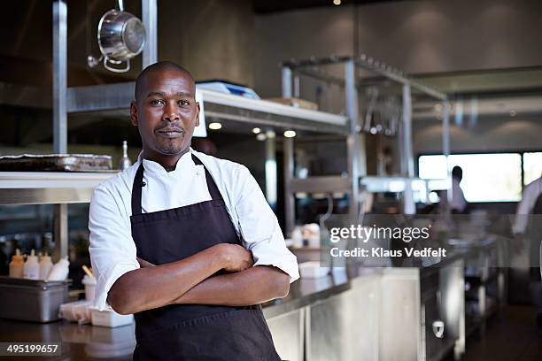 portrait of male chef at restaurant - black business owner stock-fotos und bilder