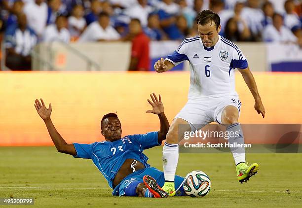Marvin Chavez of Honduras battles for the ball with Bibarn Natcho of Isreal during their Road to Brazil match at BBVA Compass Stadium on June 1, 2014...