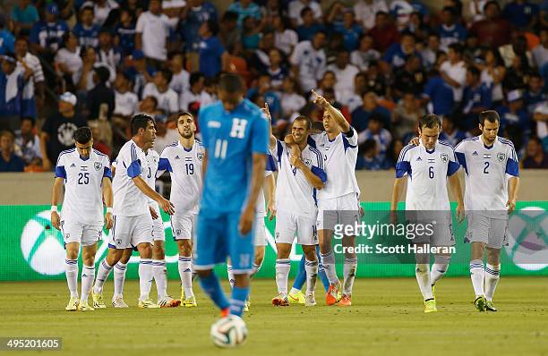 The Isreal team celebrates a second half goal as Jerry Bengtson of Honduras waits at midfield during their Road to Brazil match at BBVA Compass...
