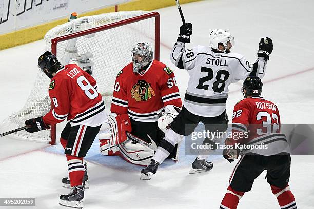 Jarret Stoll of the Los Angeles Kings celebrates the game winning goal against Corey Crawford of the Chicago Blackhawks in overtime 5 to 4 to win...