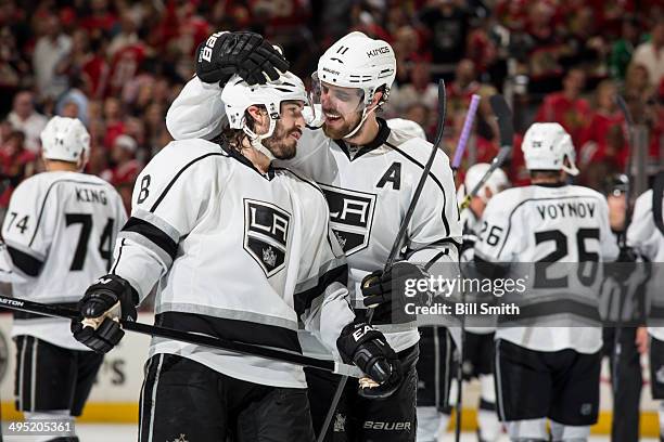 Drew Doughty and Anze Kopitar of the Los Angeles Kings celebrate after the Kings defeated the Blackhawks 5-4 in overtime, to win the Western...