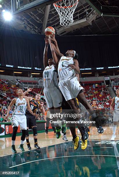 Crystal Langhorne and Camille Little of the Seattle Storm go for a rebound against the Tulsa Shock during the game on June 1,2014 at Key Arena in...