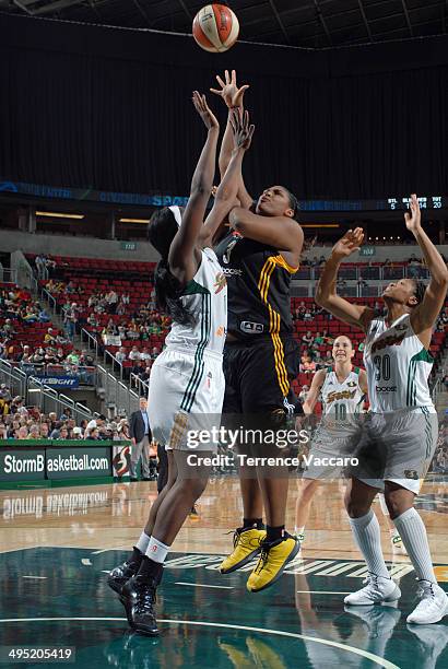 Courtney Paris of the Tulsa Shock shoots against Crystal Langhorne of the Seattle Storm during the game on June 1,2014 at Key Arena in Seattle,...