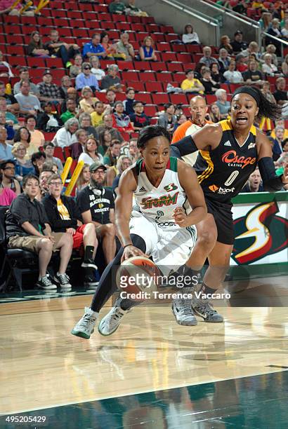 Temeka Johnson of the Seattle Storm drives against Odyssey Sims of the Tulsa Shock during the game on June 1,2014 at Key Arena in Seattle,...