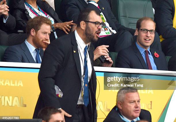 Prince Harry, Australian rugby coach Michael Cheika and Prince William, Duke of Cambridge attend the Rugby World Cup Final match between New Zealand...