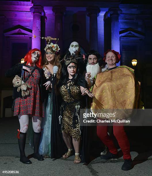 Revellers pose for photographs as they arrive for a Gothic Ball taking place inside a former church on October 31, 2015 in Londonderry, Northern...